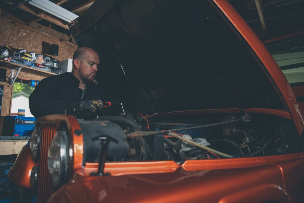 Jacobs spends his free time working on his Orange-metallic Jeep.