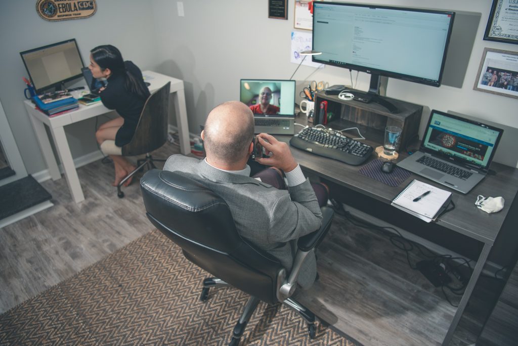 Jacob is home-working, sitting next to his wife who also happens to be working from home.