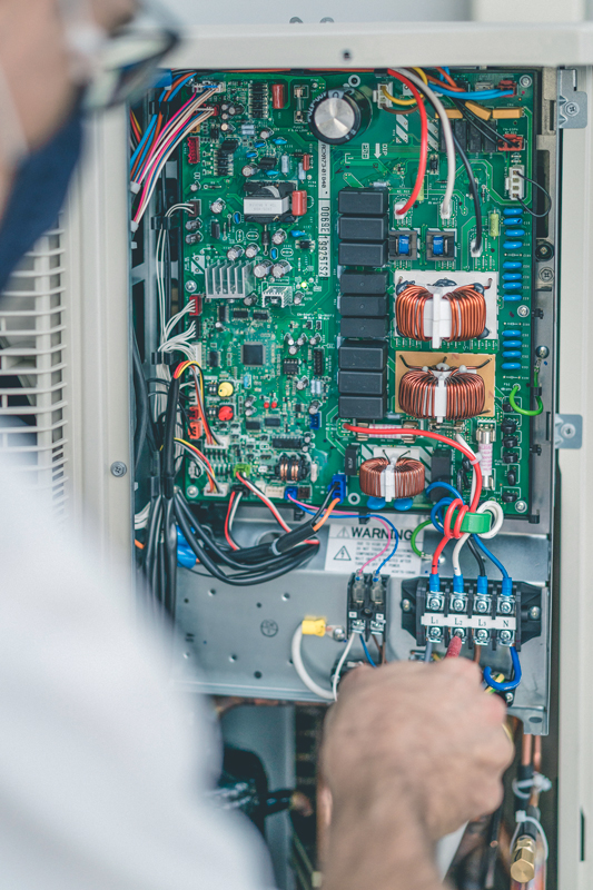 The inner electrical components of an outdoor HVAC unit