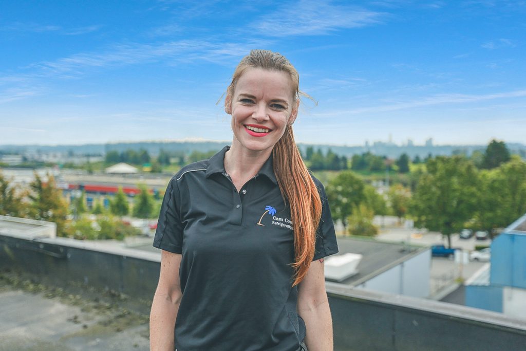 Jessica Bannister looks into the camera on a bright day in Vancouver, Canada.