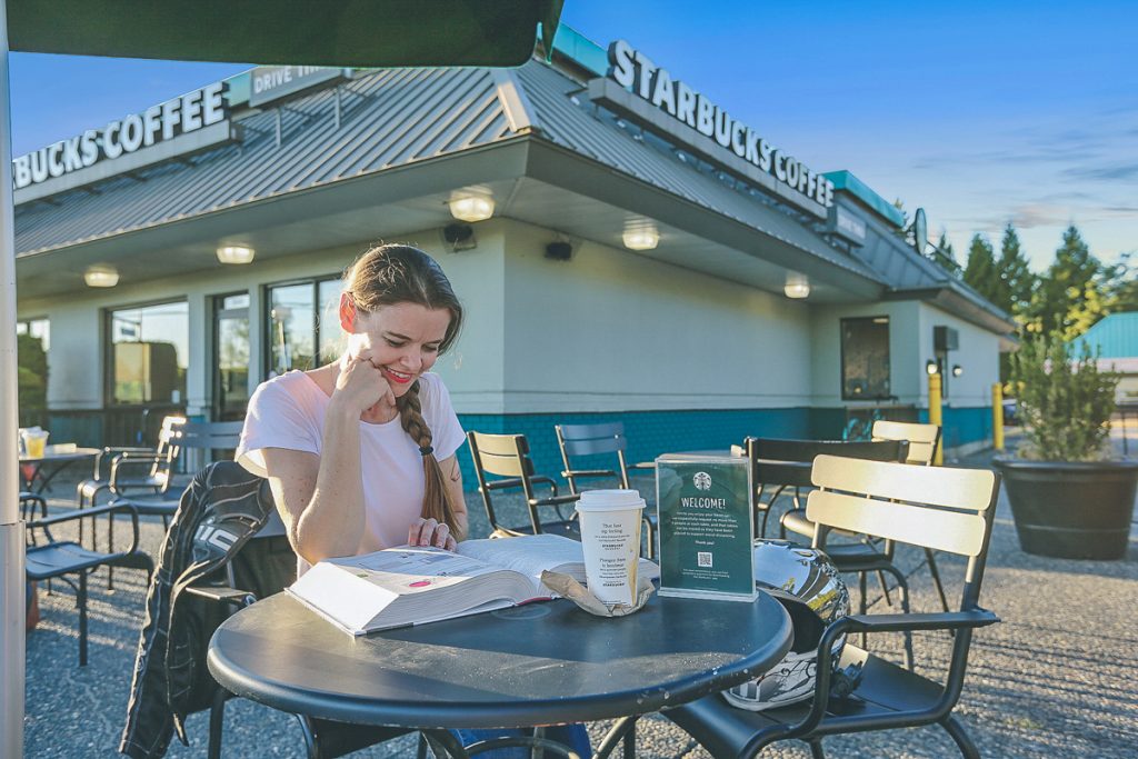 Jessica is reading an HVAC book while enjoying a coffee.