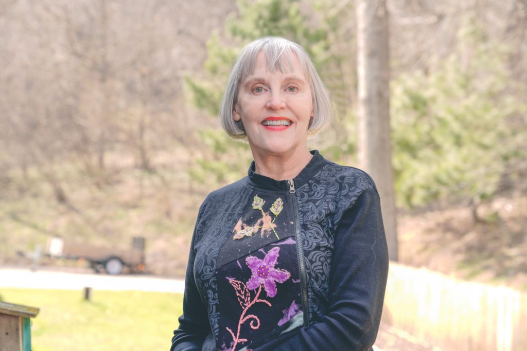 Photo of Renee Joseph. She  is outdoors, smiling at the camera.